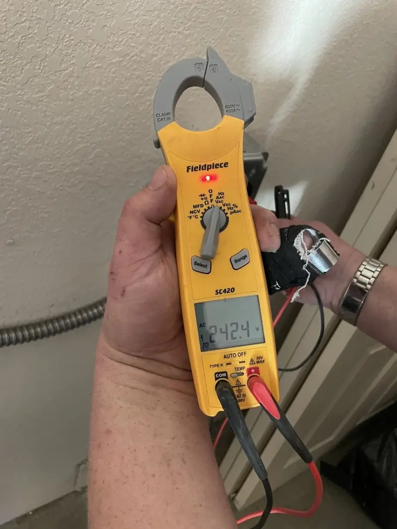 Voltage testing with clamp meter during Electrical Installation Services in West Burlington
